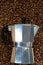 Classical Italian coffee maker pot with coffee beans