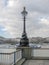 Classical lamppost detailed and banks of the River Thames
