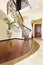 Classical mosaic stairs with ornamental handrail in hallway