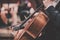 Classical music orchestra - double basses - close-up - suits - close-up on hands