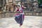 Classical odissi dancer wears traditional costume posing Mudra or Hand Gestures.