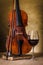 Classical old violin with red wine glass