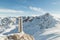 Classical steel thermos in winter in the mountains with mountains in the background