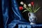 Classical still life with a blue white hand painted vase and tulips, blue curtains in the background