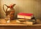 Classical still life with books and vintage jug