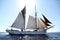 Classical, traditional wooden yacht sailing under back light in Bodrum for Bodrum Cup, Turkey