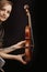 Classical violin, modern tattoo, musician\'s dual expression