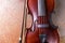 Classical violin on rusty background. Studio shot of old violin