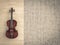 Classical violin on wooden background and raw cement