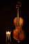 Classical violins with candle