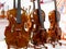 Classical violins standing on a wooden base