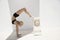 Classical Yoga Woman in Ionic Column Prop Supported Scorpion Pose