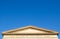 Classically elegant Art Gallery of New South Wales, the image shows the roof of it with blue sky background.