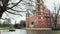 Classicist castle with yellow, red facade and water moat