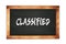 CLASSIFIED text written on wooden frame school blackboard