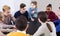 Classmates having round of Werewolf game at break between classes