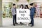 Classmates hold text of Back to School