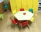 Classroom with chairs and the hexagonal child-friendly table