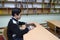 Classroom of the medrese. Muslim boy sitting at a school desk, Quran placed in front of him