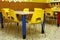 Classroom of a school with the little yellow chairs