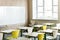 Classroom with wooden desks, chairs, window