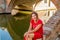 Classy woman sitting on bridge