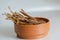 Clay bowl with chicken jerks. Light background. Eye level shooting. Soft focus.