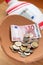 Clay broken money saving box with euro coins and banknotes. Home financial investment