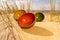 Clay ceramic bowls placed on the side of the sea beach in the yellow sand. Inside the bowl reama green, yellow and reddish glass