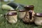 Clay cups and kitchenware on green grass