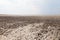 Clay in flat plain, steppe, salt, salt lake, heat and sky
