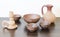 Clay handmade bowls, candlestick and milk jug