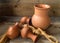 Clay jars,different size, on old wooden table