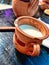 Clay jug milk on table photography