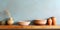 Clay plate and bowls on kitchen countertop and shelf with pottery above it. Close up background of interior design of kitchen