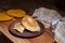 Clay plate of fried meat pies on wooden table