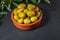 Clay pot with artisan olives.