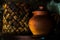 Clay pot with a lid on the background of a wicker basket