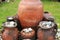 The clay pots are arranged in groups, with large, tall vessels s