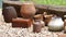 Clay pots arranged in a row as a decoration, an ornament in the garden