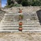 Clay pots ascending stone steps at the Old Fortress, Corfu Town, Greece