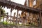 Clay pots hanging on willow rods of the fence. Traditional rural decor