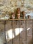 Clay pots on shelf in sunlit barn interior