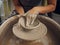 Clay, pottery or hands in designer workshop working on an artistic cup or mug mold in small business studio. Hand of