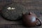 Clay teapot and black puer on wooden background