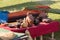 Clay utensils on table with a red cloth coverings