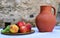 Clay water jug â€‹â€‹and fruit plate