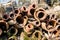 Clay water pipes. Polluted environment, waste and surroundings cleaning