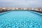 Clean and appetizing blue swimming pool ready to dive in urban surrounding. Generative AI