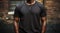 Clean black t-shirt African-American man, urban brick wall background